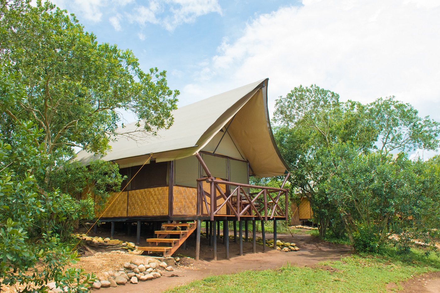 Self-contained luxury banda surrounded by indigenous bush in Queen Elizabeth National Park, Uganda