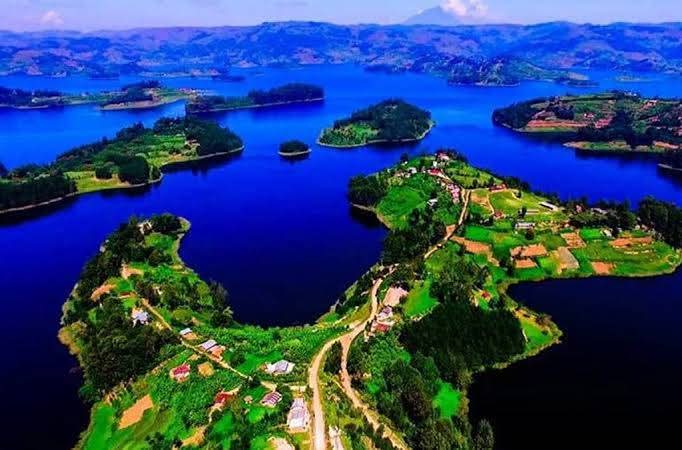 Peaceful Lake Bunyonyi surrounded by green hills and dotted with islands in southwestern Uganda