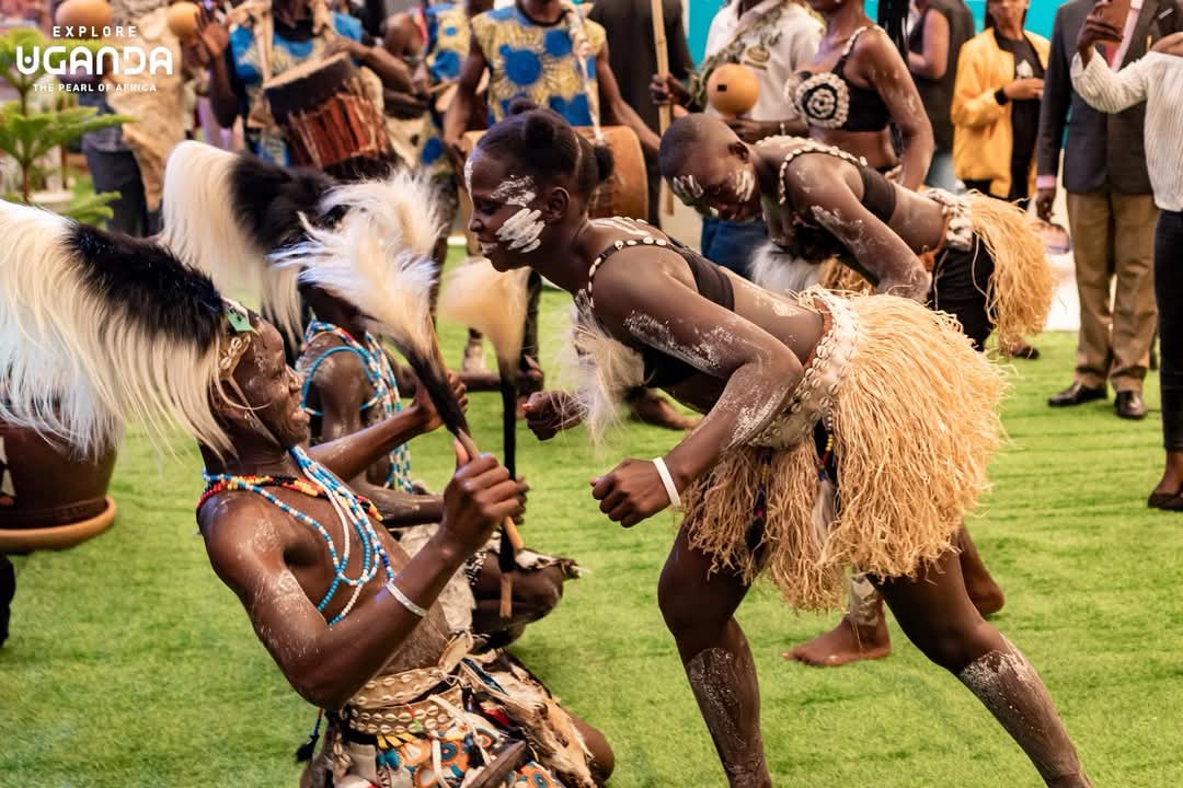 Community members enjoying a traditional dance performance in Uganda.