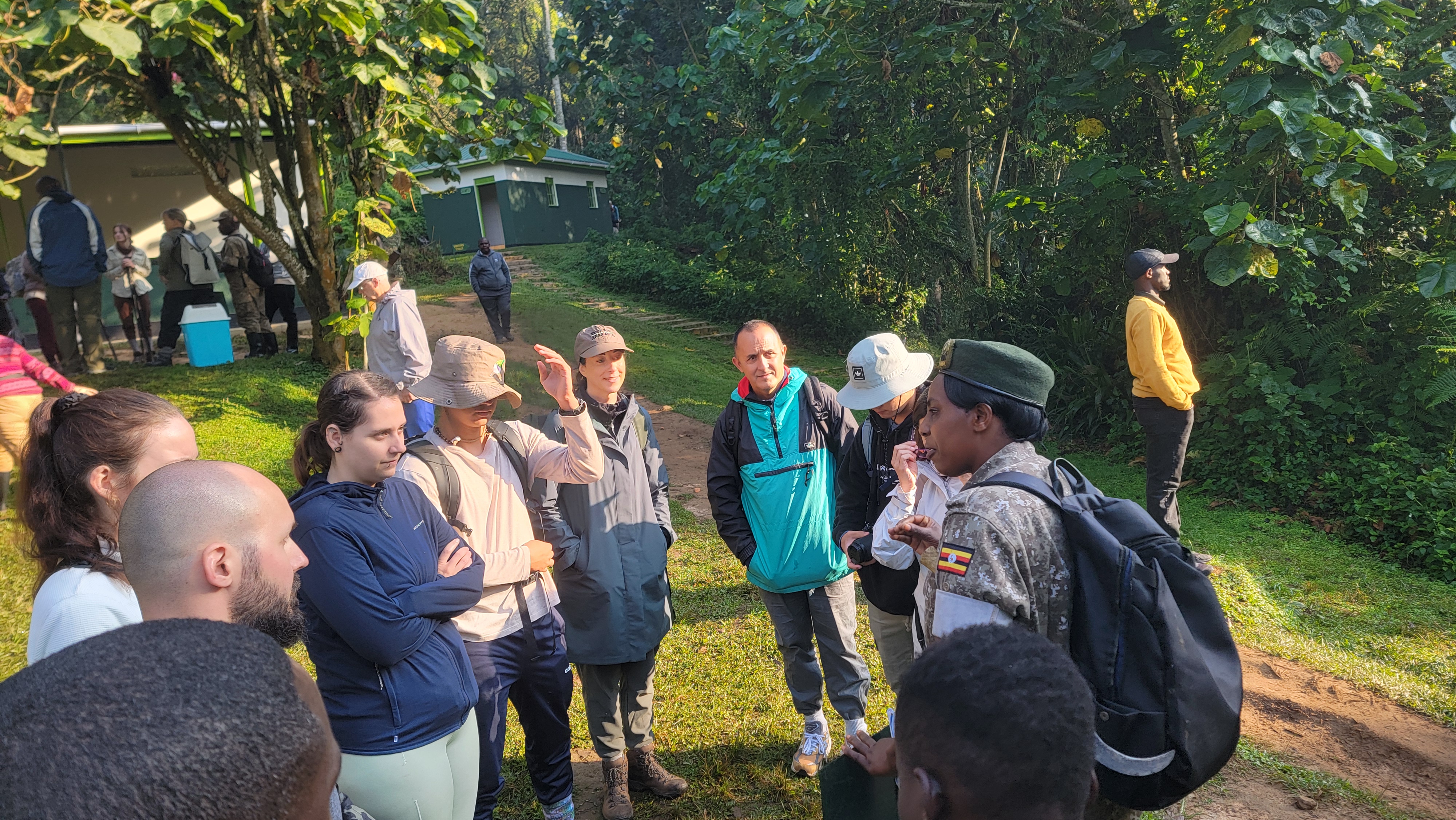 A group of travelers with ranger guide briefing them before the gorilla trekking, Bwindi-Uganda.
